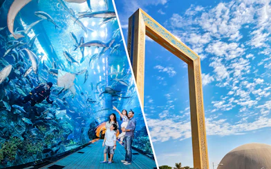 Dubai Aquarium tunnel with family and diver, Dubai Frame against blue sky.