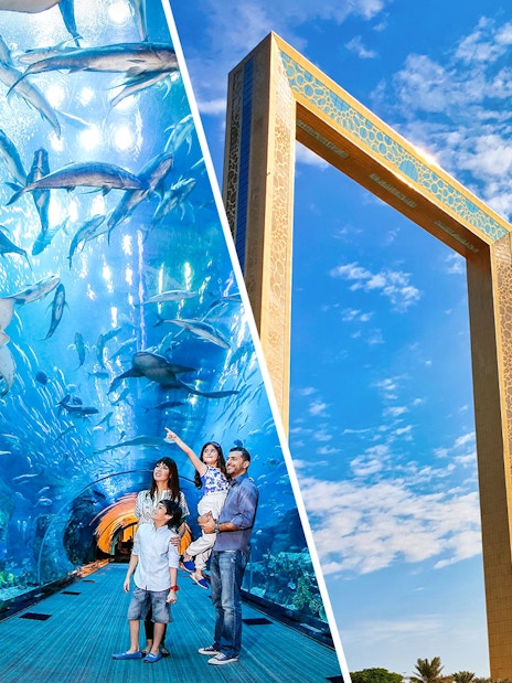 Dubai Aquarium tunnel with family and diver, Dubai Frame against blue sky.