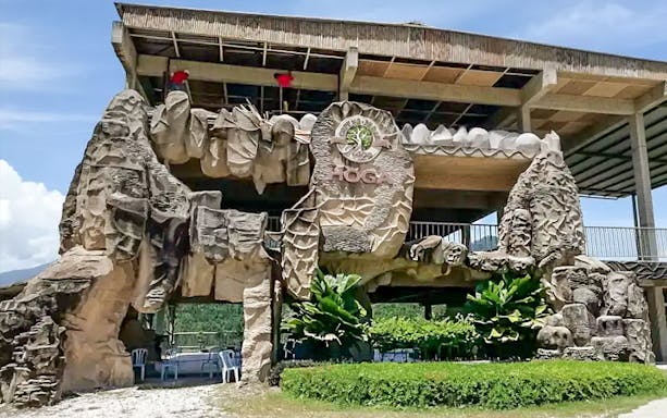 Gaharu Tea Valley entrance with stone carvings in Gopeng, Perak.