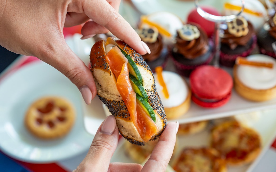 Smoked salmon sandwich and pastries on Paddington Afternoon Tea Bus.
