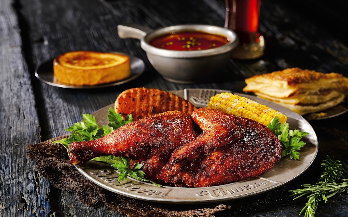 Roasted chicken with corn and bread at Medieval Times Dinner and Show.