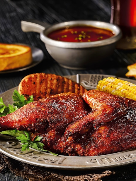 Roasted chicken with corn and bread at Medieval Times Dinner and Show.