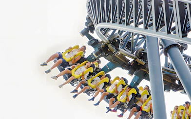 Riders on the Tornado roller coaster at Parque de Atracciones de Madrid.