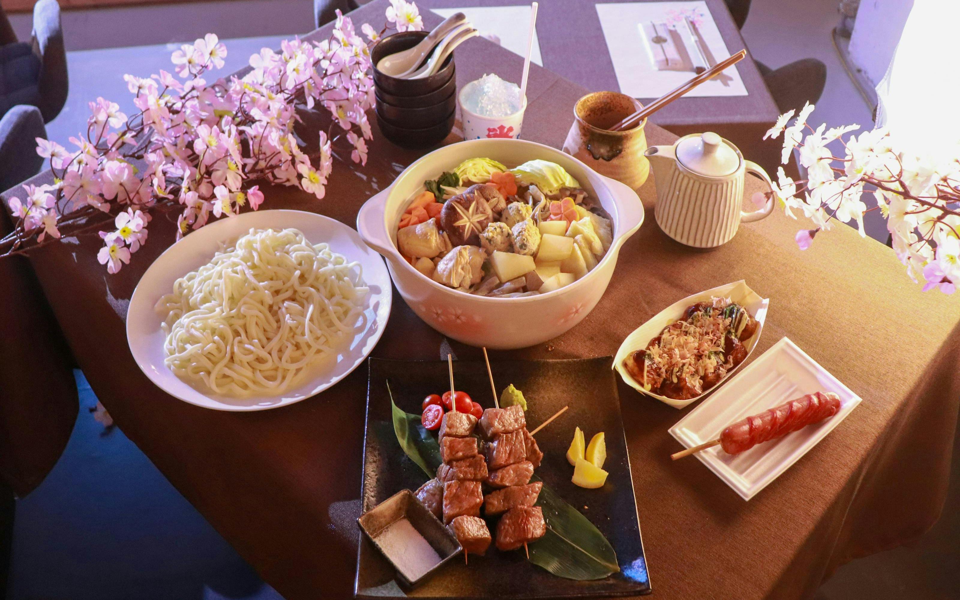 Chanko-nabe hot pot with noodles and skewers at Sumo Practice Show, Ochiizumibeya, Japan.