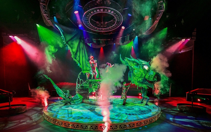 Performers with dragon puppet on stage at CARO Theatre Show, Efteling.