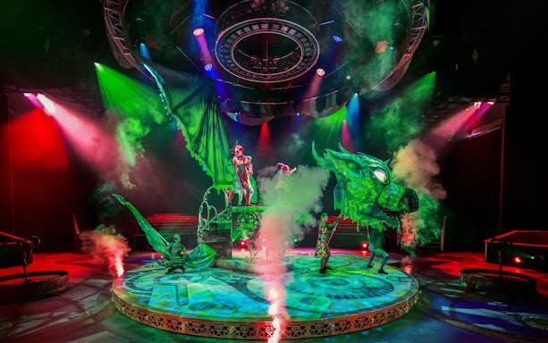 Performers with dragon puppet on stage at CARO Theatre Show, Efteling.