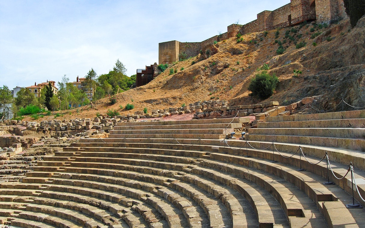 Roman Theater steps with Alcazaba Castle in the background, Málaga walking tour.