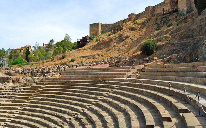 Roman Theater steps with Alcazaba Castle in the background, Málaga walking tour.