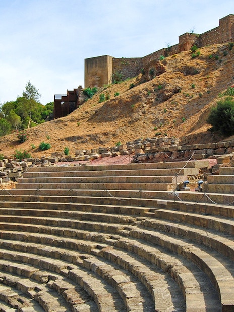 Roman Theater steps with Alcazaba Castle in the background, Málaga walking tour.