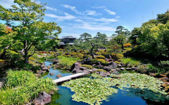 Yuushien Park in Matsue, Japan with pond, lily pads, and traditional garden landscape.