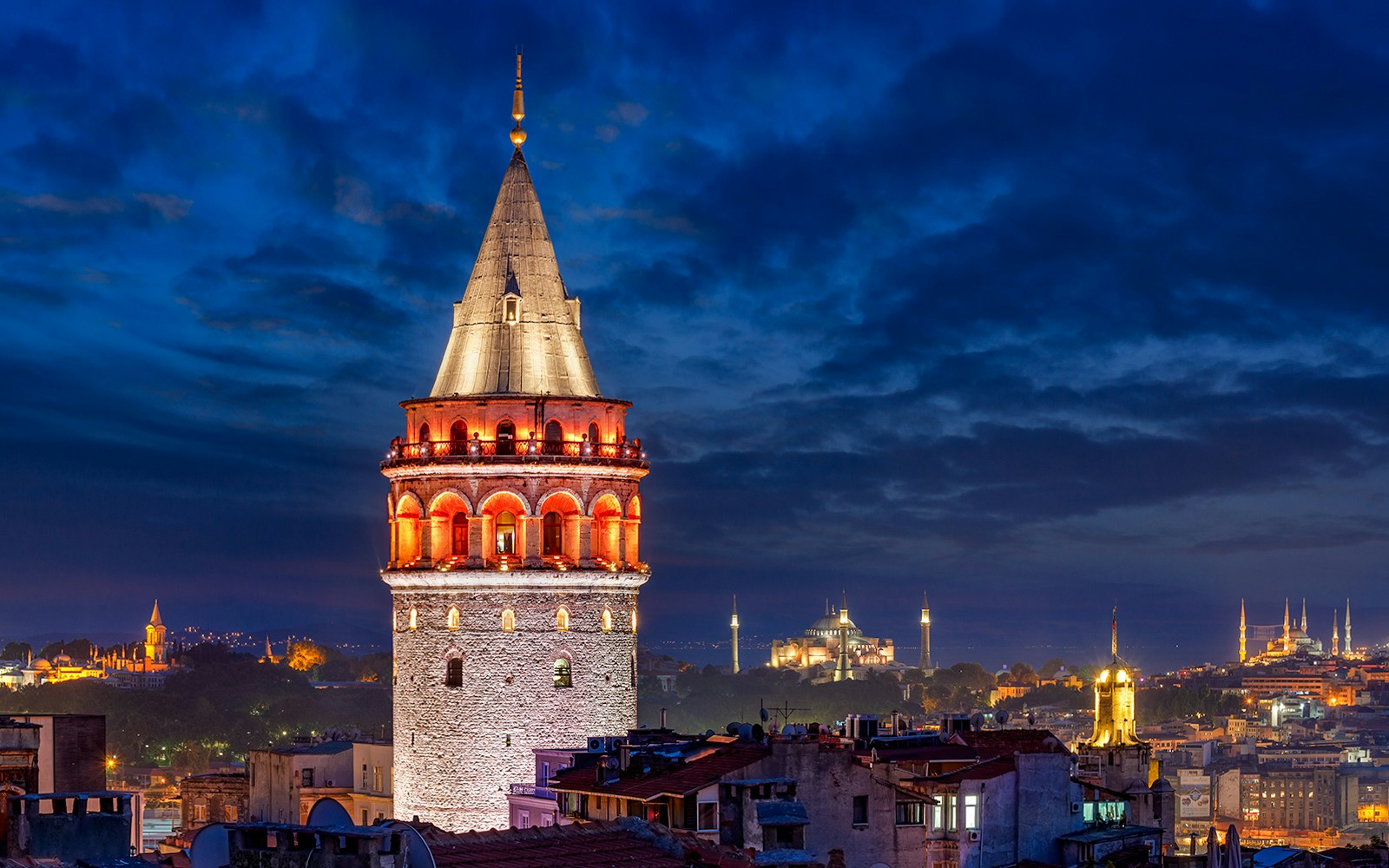 Galata Tower in Istanbul with cityscape view in the background.