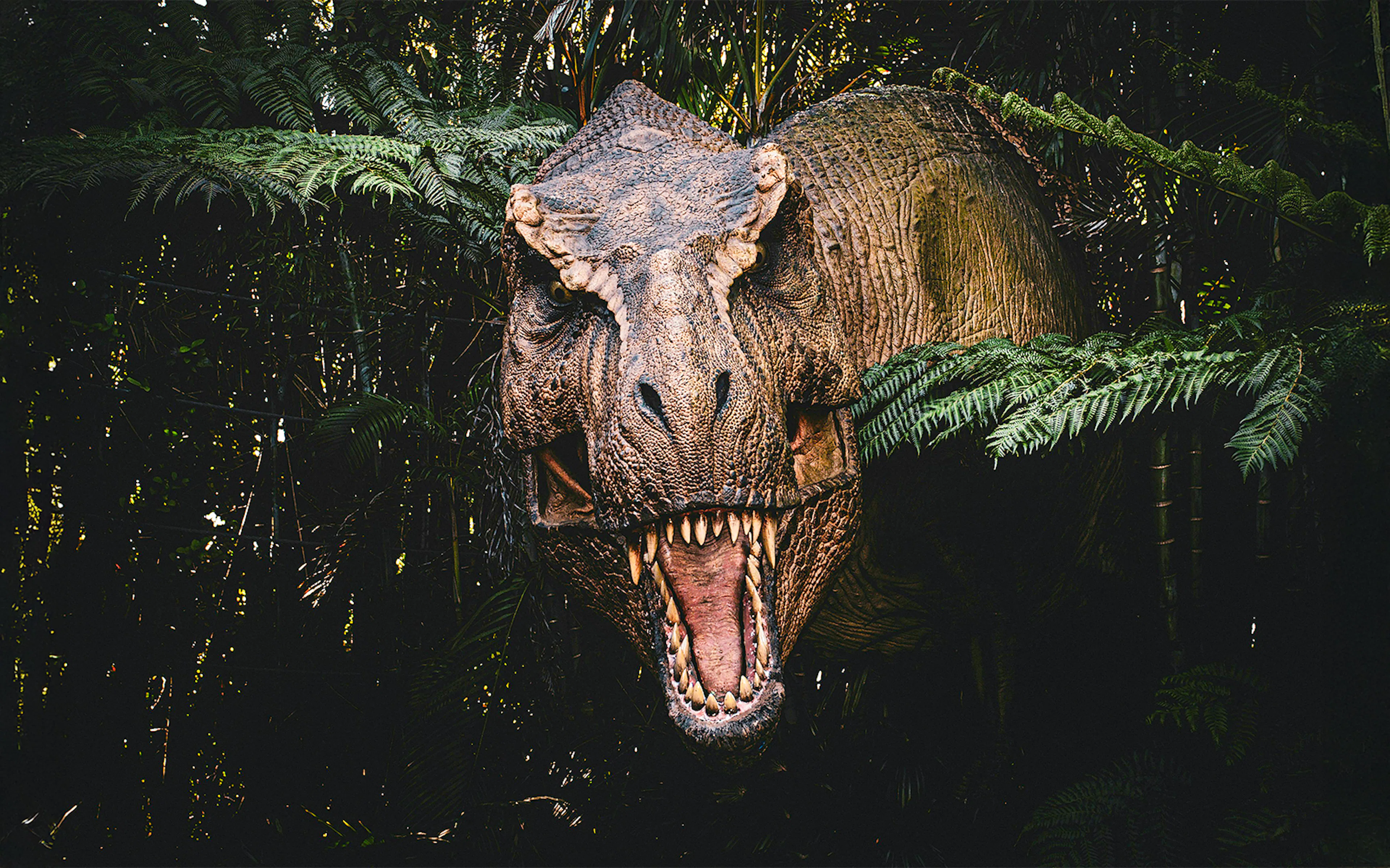 Trex emerging from bushes at Jurassic Park attraction, london