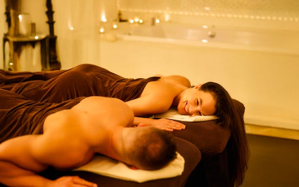 Couple enjoying a relaxing massage at Mandala Day Spa.