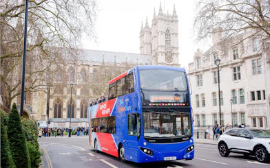 Golden Tours hop-on hop-off bus near Westminster Abbey, London.