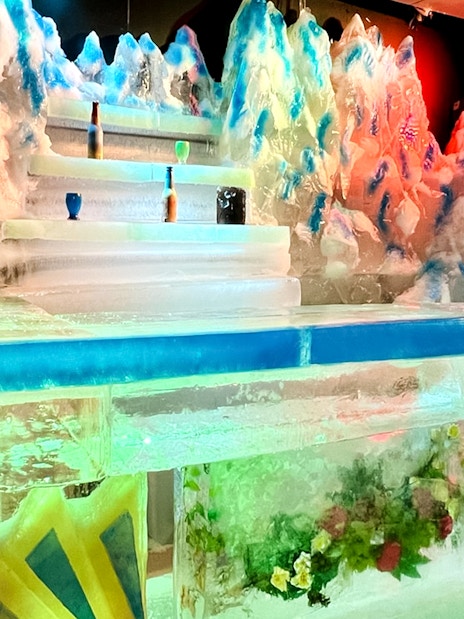 Dyed ice sculptures and colorful lights at Singapore Snow City's playground.