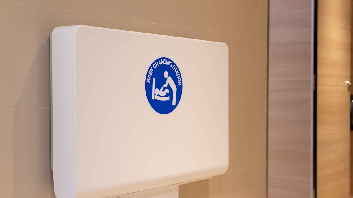 Baby changing station in a restroom at a baby care centre.