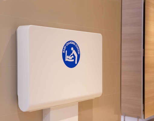 Parents and child at a Baby Care Centre during a family-friendly tour