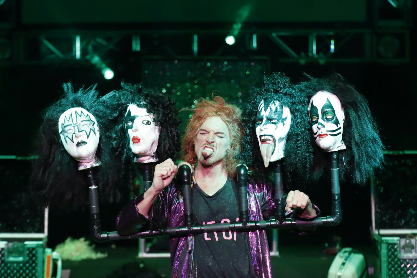 Performer with rock band masks at Carrot Top show in Las Vegas.