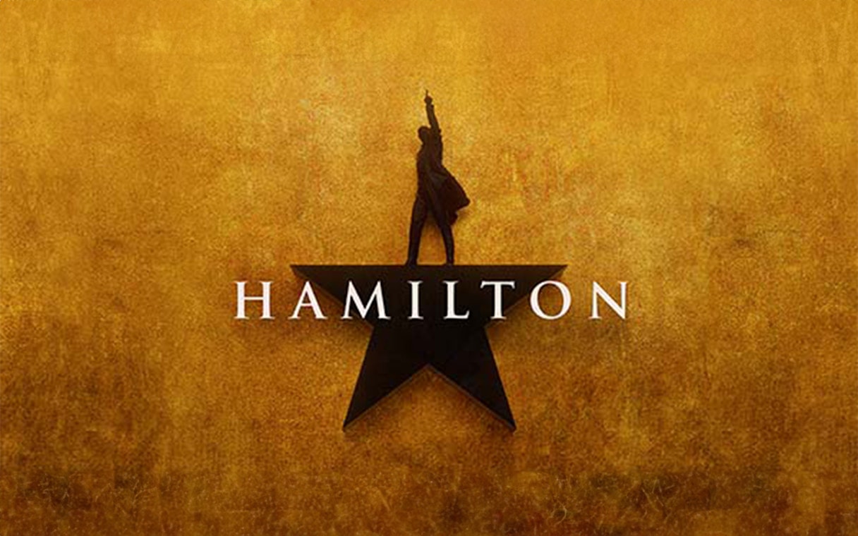 Hamilton musical logo with silhouette on star background.