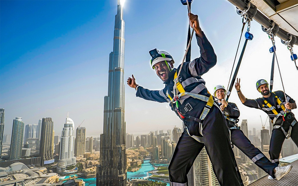 Visitors enjoying the Sky Views experience with Burj Khalifa in the background, Dubai.