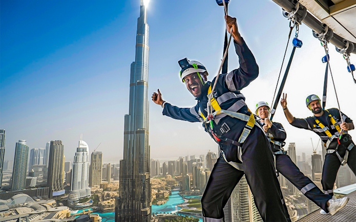 Visitors enjoying the Sky Views experience with Burj Khalifa in the background, Dubai.
