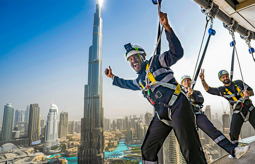 Visitors enjoying the Sky Views experience with Burj Khalifa in the background, Dubai.
