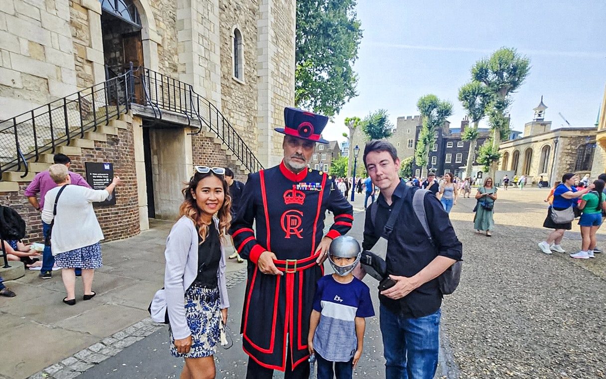 Beefeater with tourists at the Tower of London.