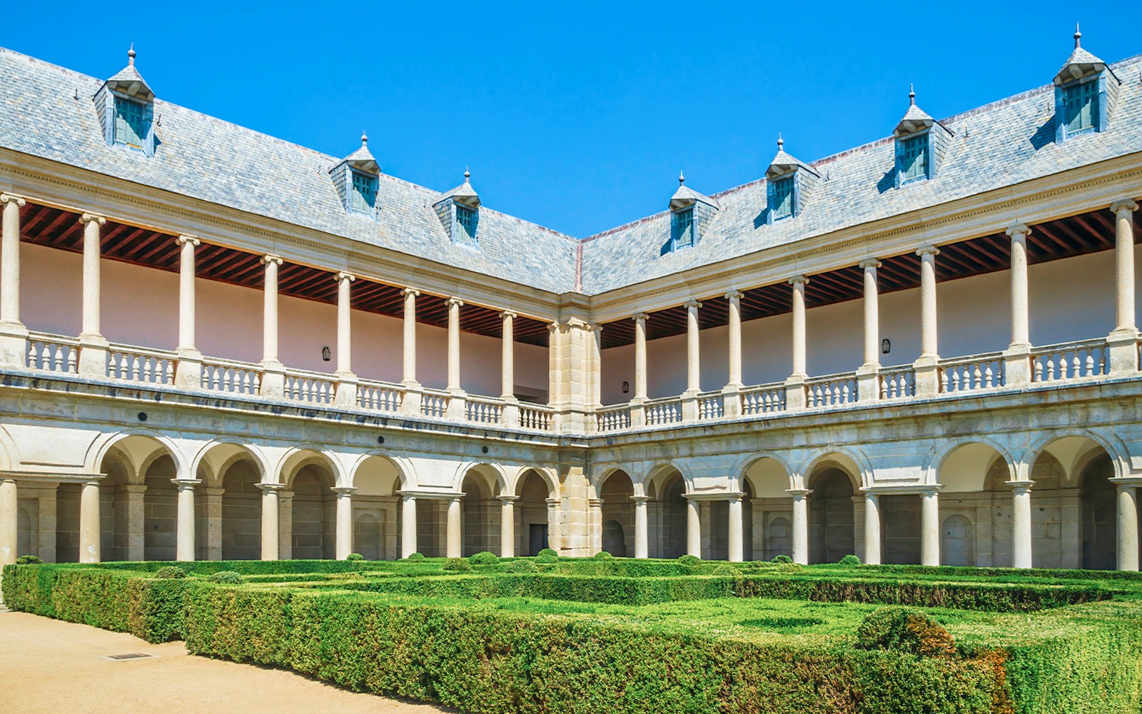 Renaissance cloister and gardens at Monastery of San Lorenzo de El Escorial, Spain.