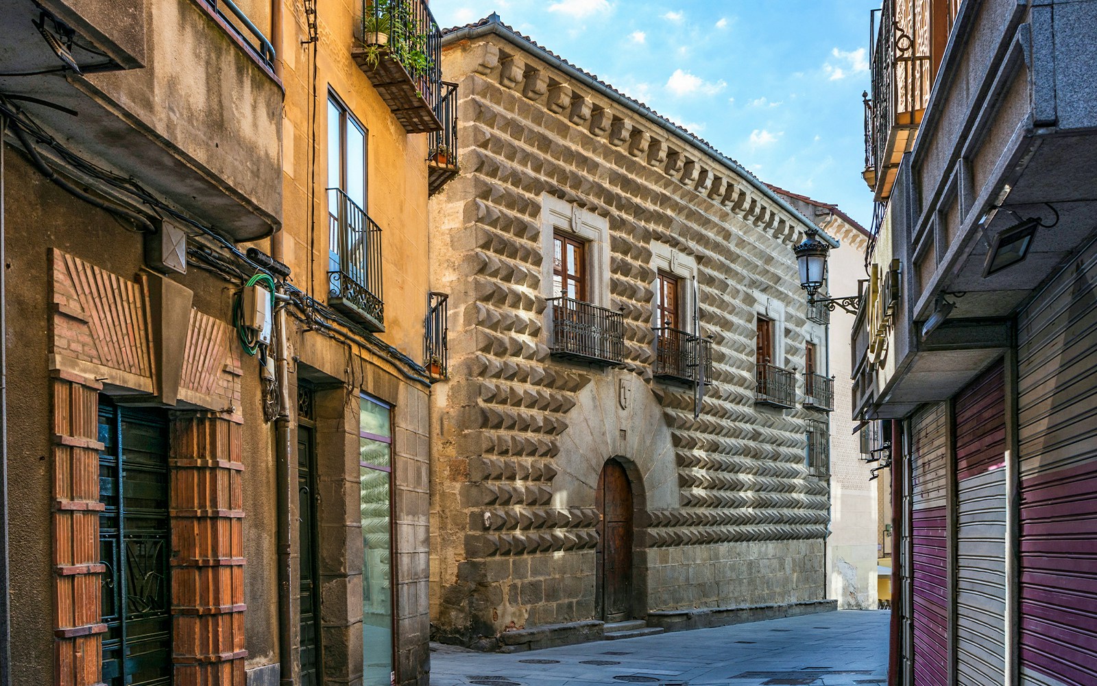 Casa de los Picos facade with diamond-cut granite blocks in Segovia, Spain.