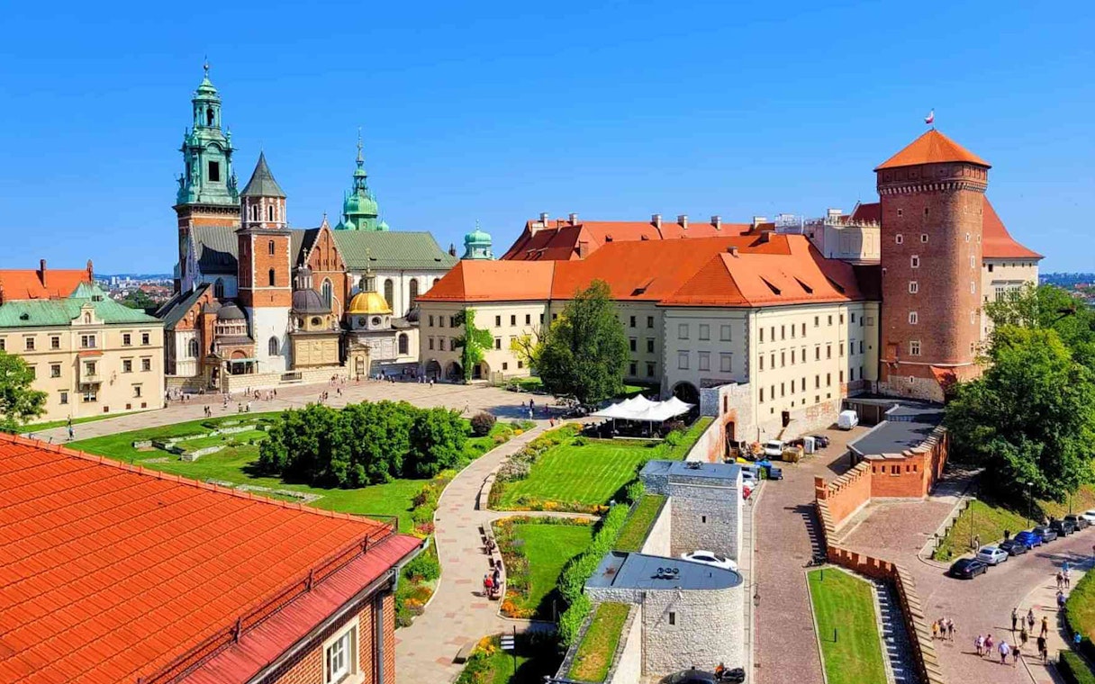 Wawel Castle courtyard with historic buildings and gardens, Krakow, Poland.