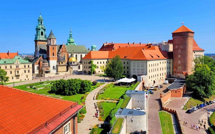 Wawel Castle courtyard with historic buildings and gardens, Krakow, Poland.