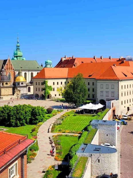 Wawel Castle courtyard with historic buildings and gardens, Krakow, Poland.