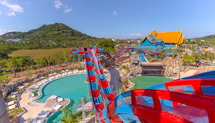 Water slide at Andamanda Phuket with pool and scenic mountain view.