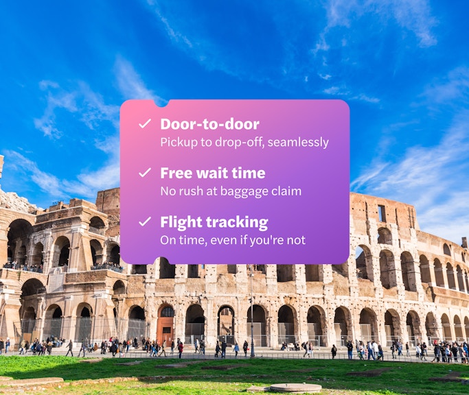 Panoramic view of the Colosseum in Rome with a clear blue sky.
