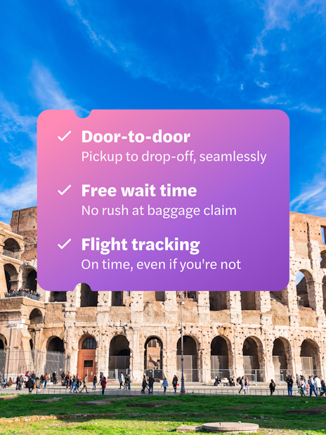 Panoramic view of the Colosseum in Rome with a clear blue sky.