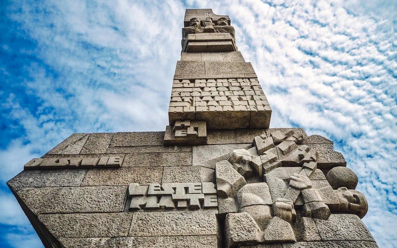 Westerplatte Monument in Gdansk, Poland, featuring carved stone figures and inscriptions.