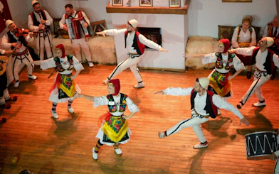Artists performing traditional dance during Albanian Night Cultural Dance & Music Experience.