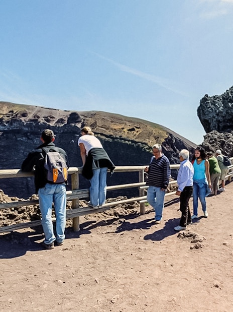 Tourists walking along a hiking trail at Mount Vesuvius, Italy.