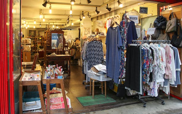 Seoul boutique with clothing racks and traditional items on a private walking tour.