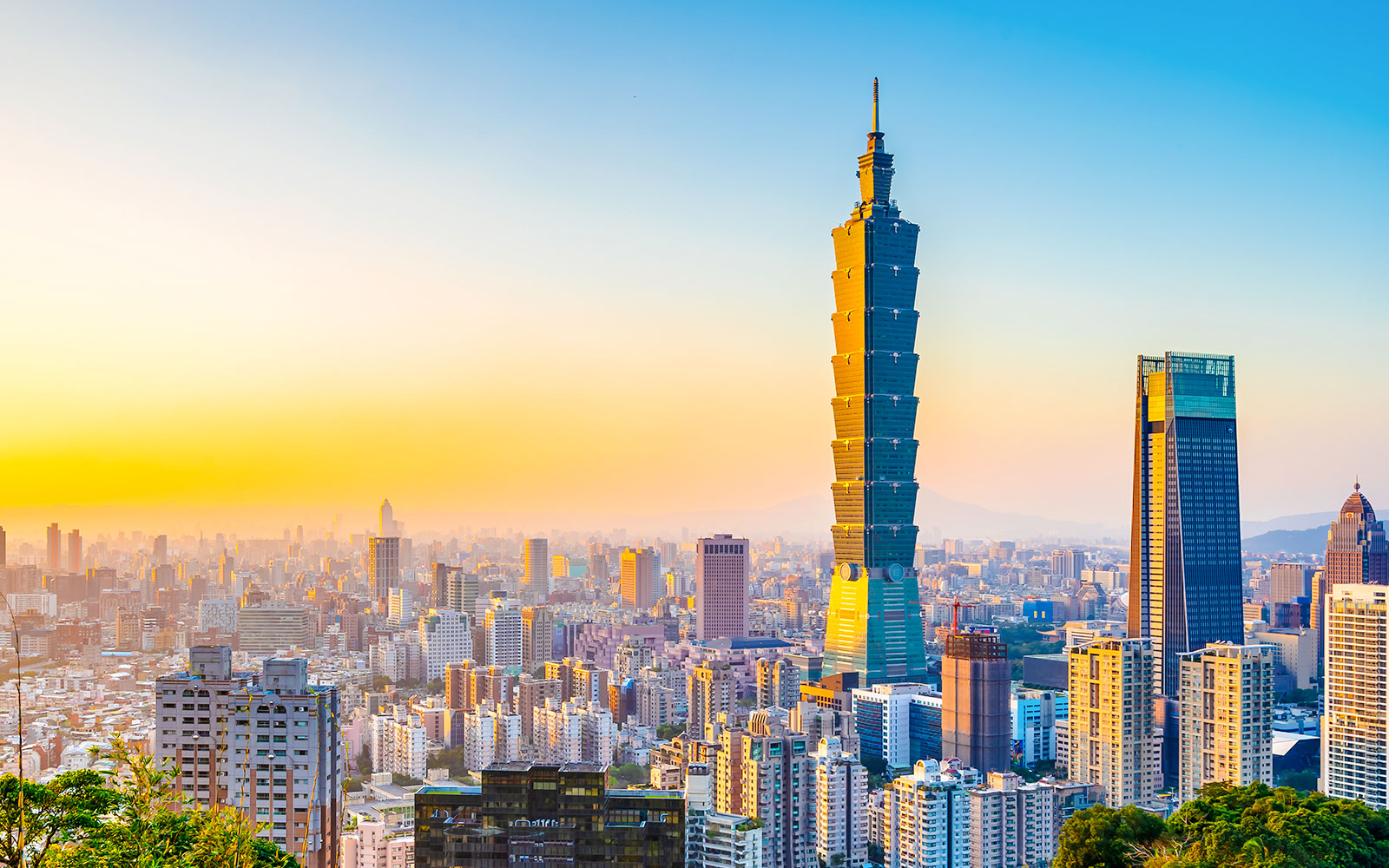 Taipei 101 skyscraper at sunset in Taipei, Taiwan skyline.
