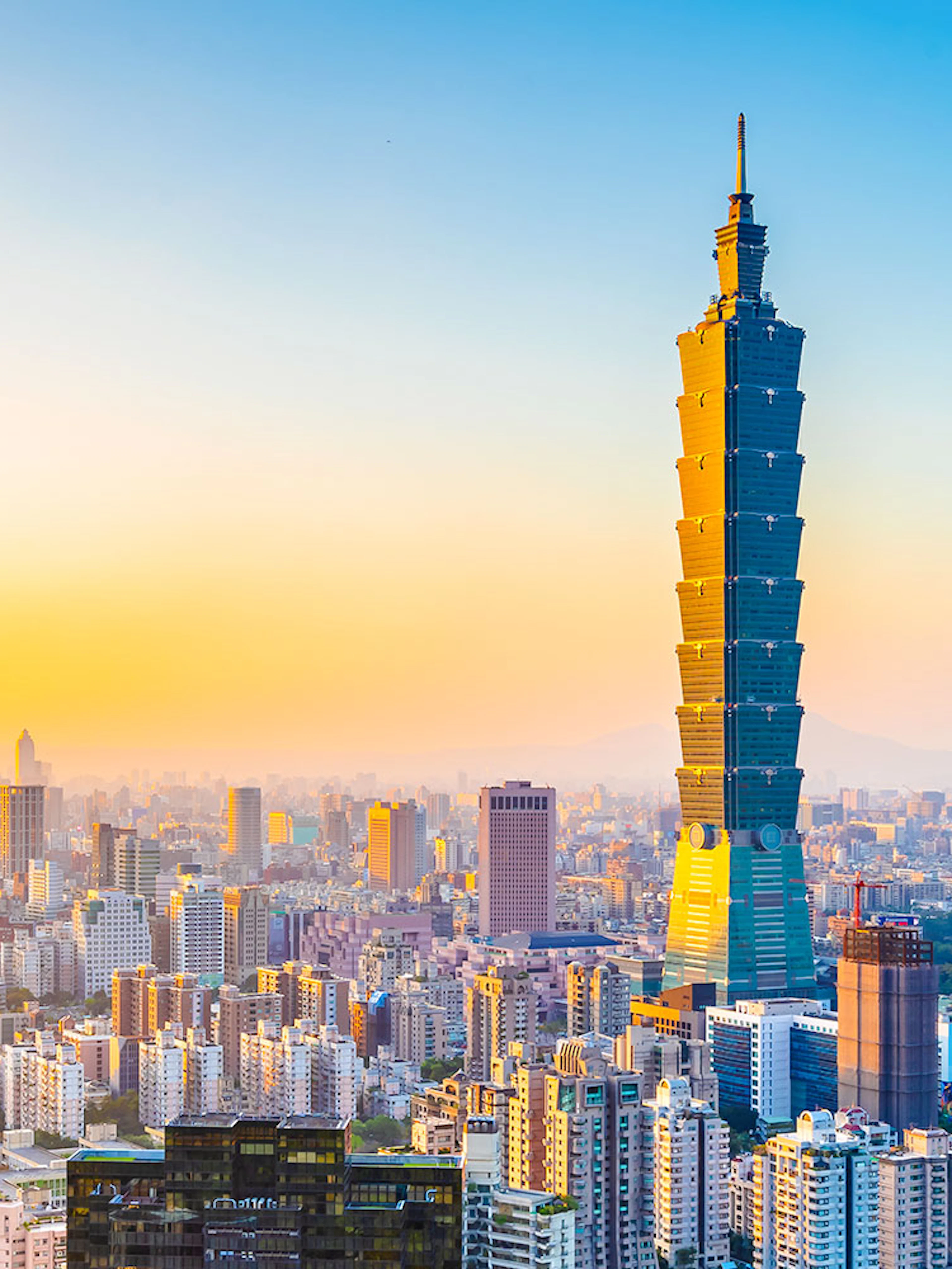 Taipei 101 skyscraper at sunset in Taipei, Taiwan skyline.