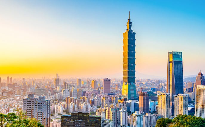 Taipei 101 skyscraper at sunset in Taipei, Taiwan skyline.