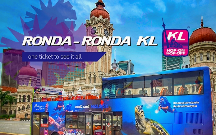 KL Hop-on Hop-off bus in front of Sultan Abdul Samad Building, Kuala Lumpur.