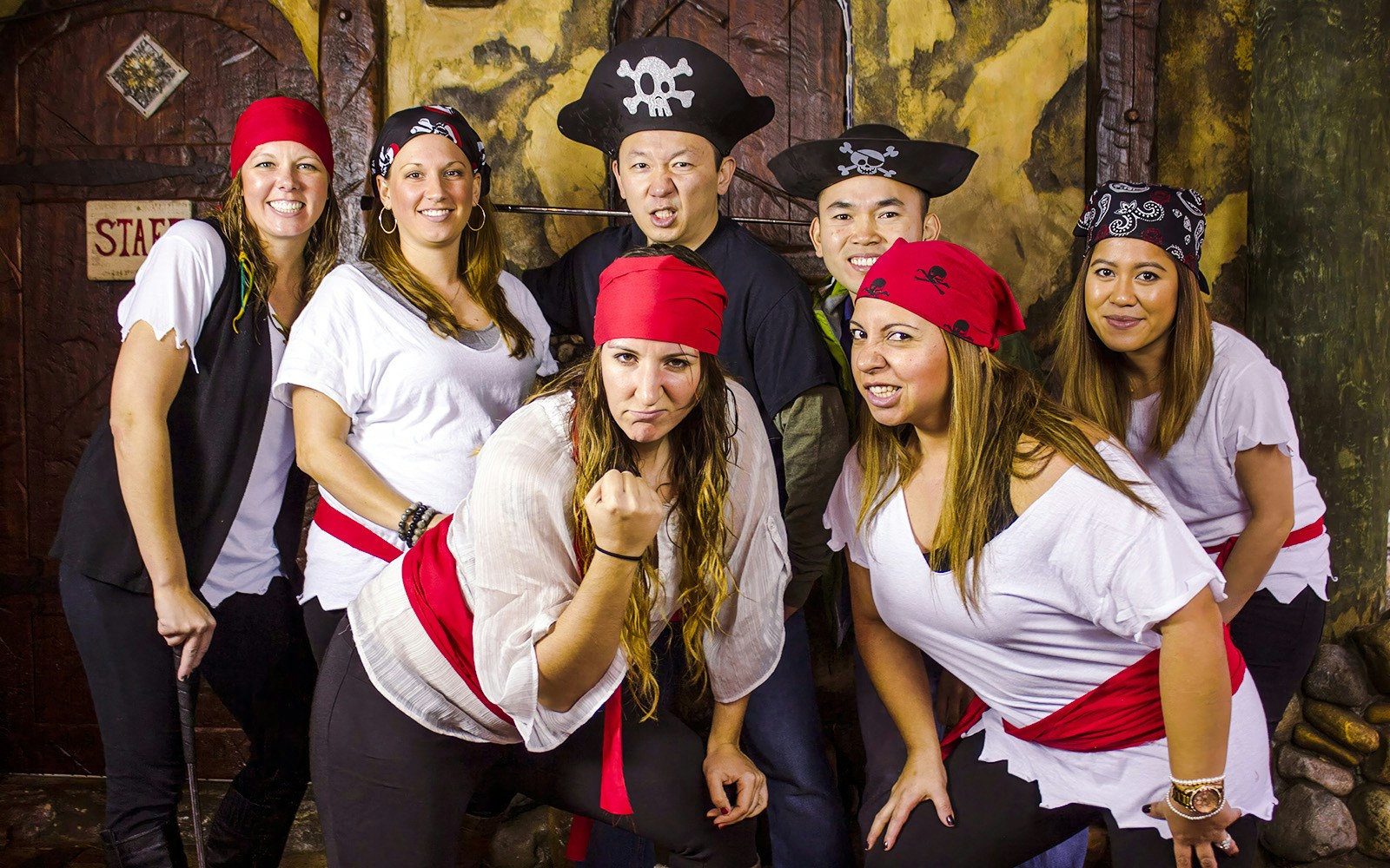Group dressed as pirates at Pirate's Cove Adventure Golf.