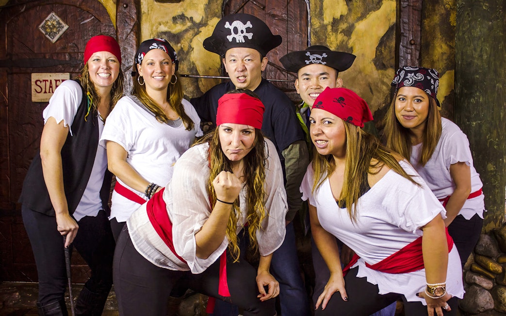 Group dressed as pirates at Pirate's Cove Adventure Golf.