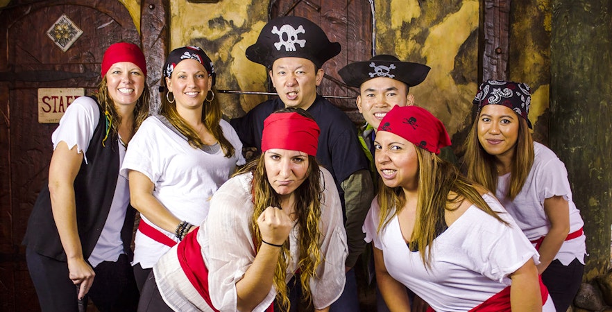 Group dressed as pirates at Pirate's Cove Adventure Golf.