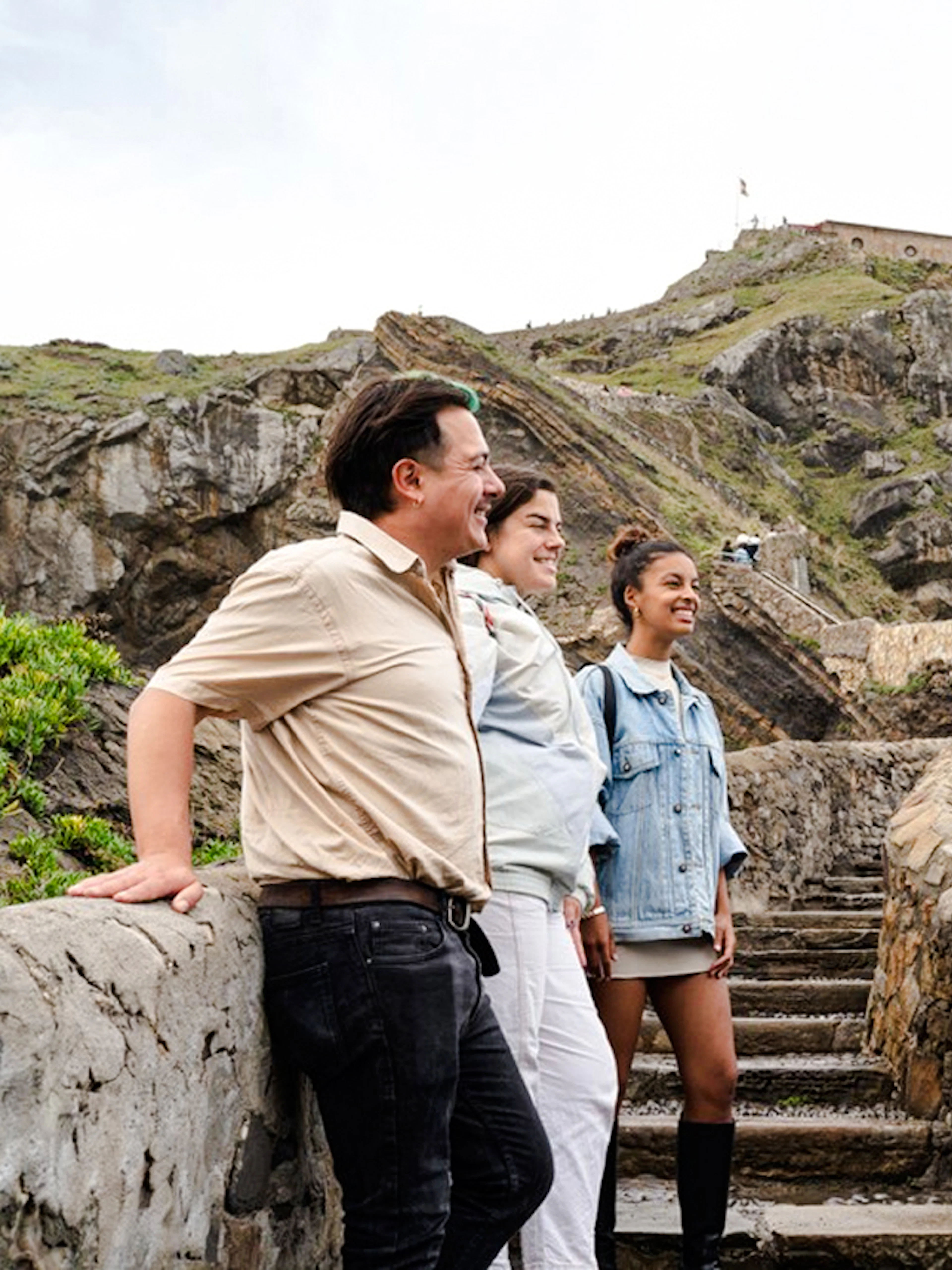 Tour group exploring San Juan de Gaztelugatxe near Bilbao.