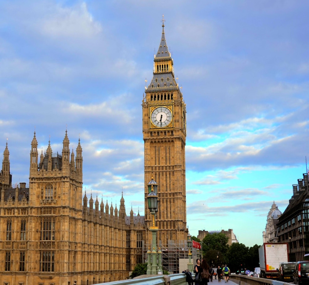 Gondola ride on a canal in Venice City with historic buildings in the background.