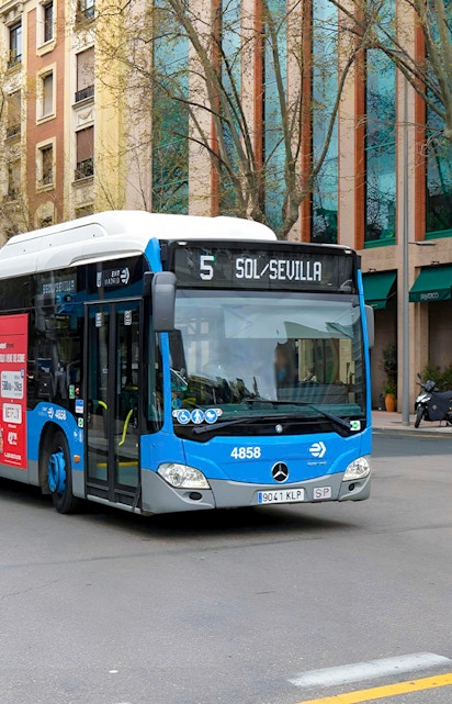 Bus on a street in Madrid, Spain, near Atocha Bus Station.