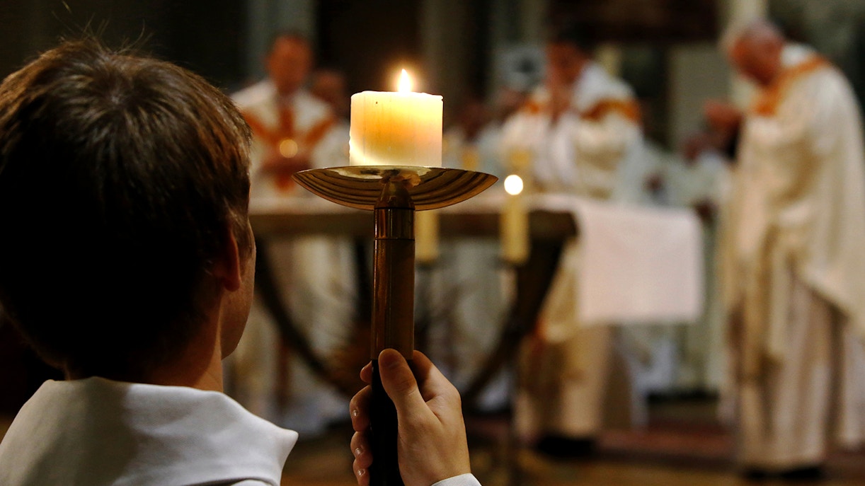 Notre Dame Cathedral interior during mass, Paris, France.
